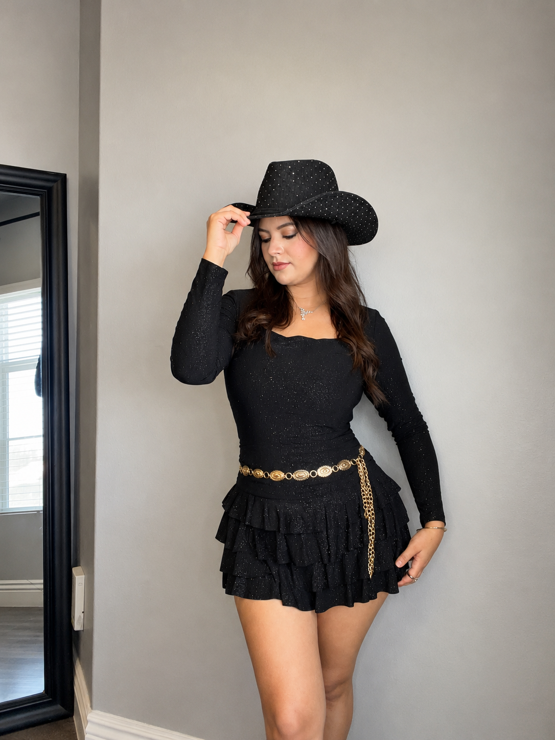 Short ruffle dress with shorts under and glitter fabric.