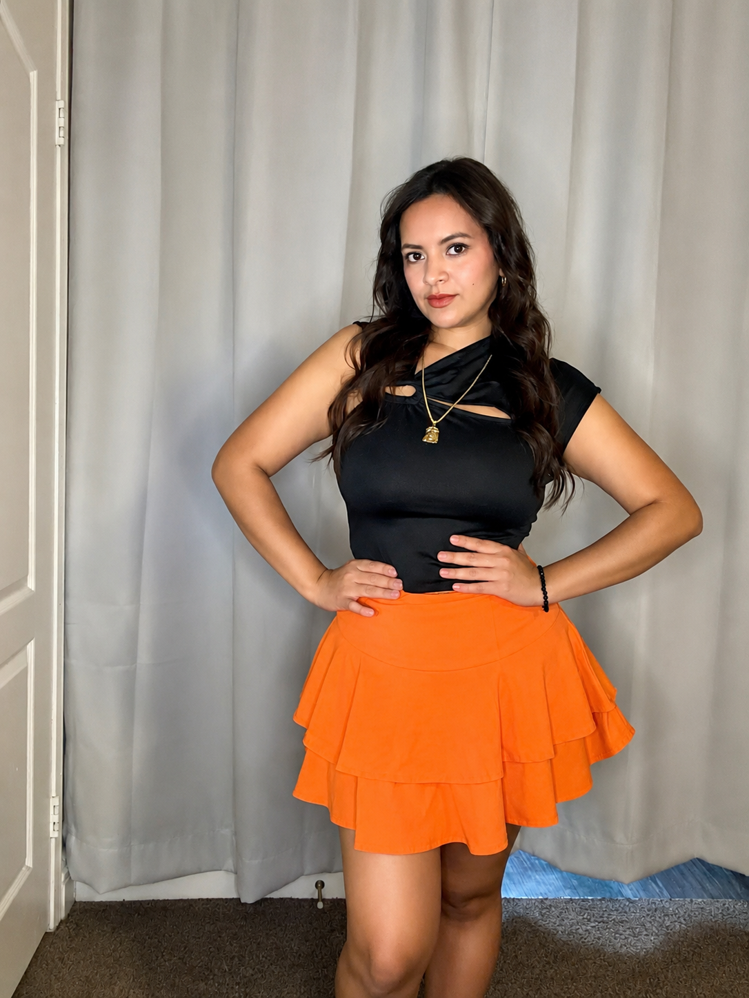 asymmetric blouse with a front cutout.