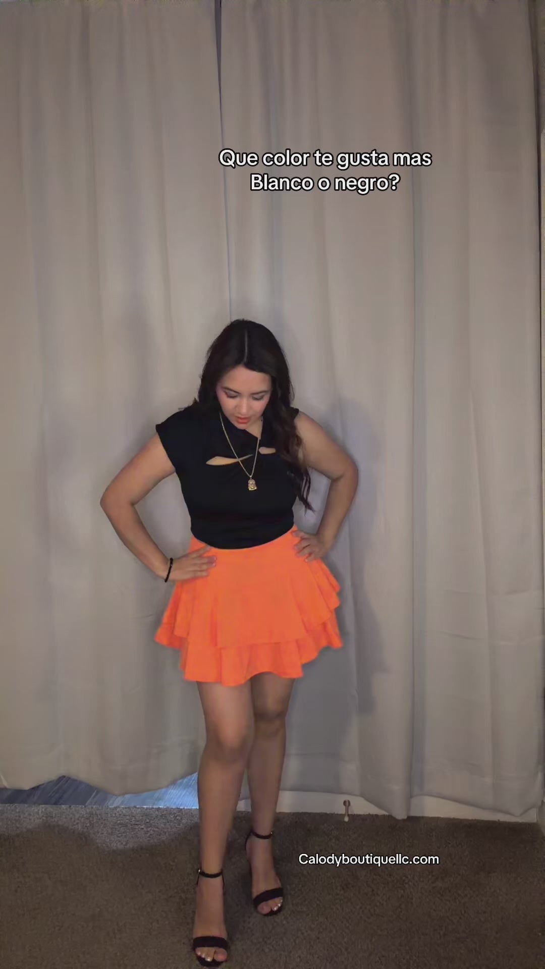 asymmetric blouse with a front cutout.